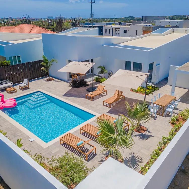 Villa pool deck with sun loungers from above