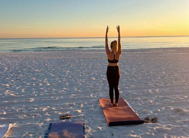 Sunrise yoga on the sand